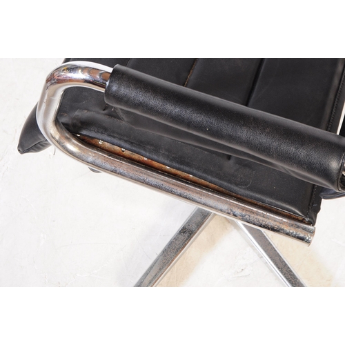 580 - A pair of vintage mid 20th century metal and leatherette chrome office swivel desk chairs. Having a ... 