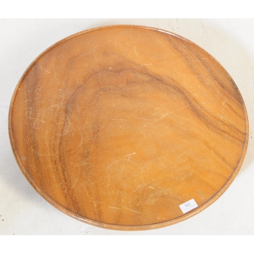 583 - A 20th century walnut wood table top lazy Susan. The lazy Susan, rotating above a rounded base, with... 