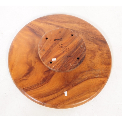 583 - A 20th century walnut wood table top lazy Susan. The lazy Susan, rotating above a rounded base, with... 