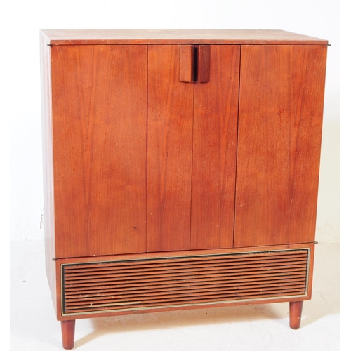 584 - British Modern Design - A mid 20th century teak veneer Hi-Fi cabinet cupboard. The cupboard raised o... 