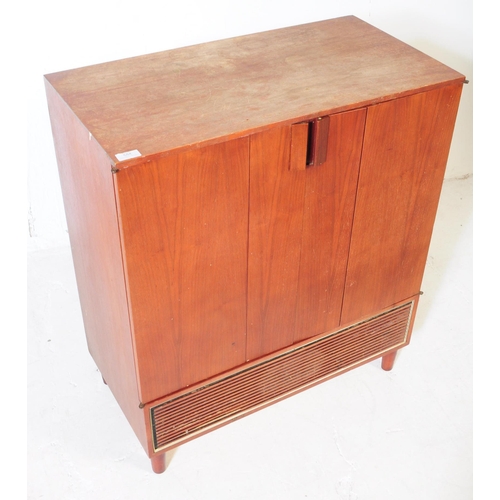 584 - British Modern Design - A mid 20th century teak veneer Hi-Fi cabinet cupboard. The cupboard raised o... 