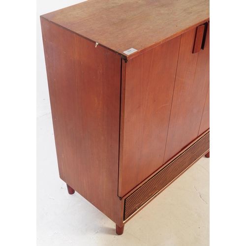 584 - British Modern Design - A mid 20th century teak veneer Hi-Fi cabinet cupboard. The cupboard raised o... 