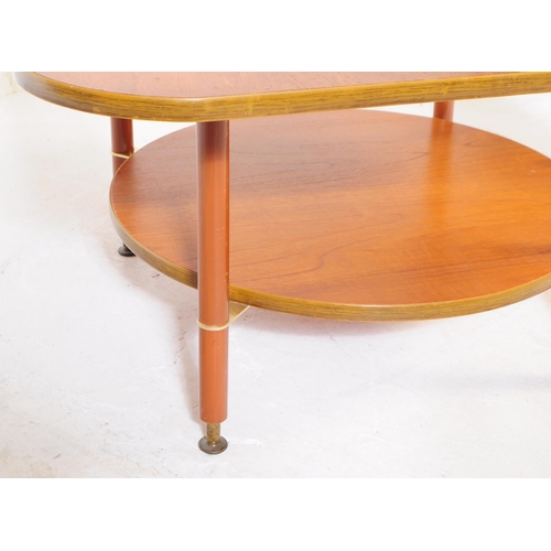 587 - British Modern Design - A mid 20th century formica and teak coffee table. The table featuring a circ... 