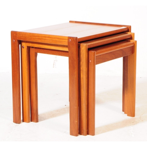 594 - British Modern Design - A mid 20th century teak wood nest of tables. The tables raised on squared le... 