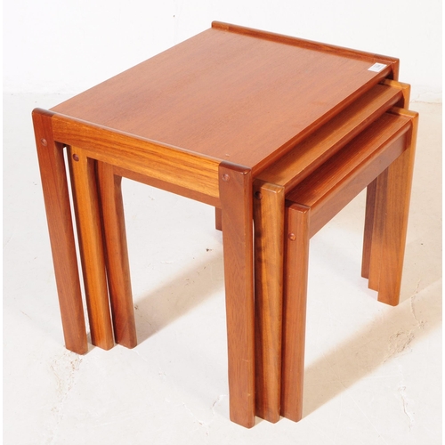 594 - British Modern Design - A mid 20th century teak wood nest of tables. The tables raised on squared le... 