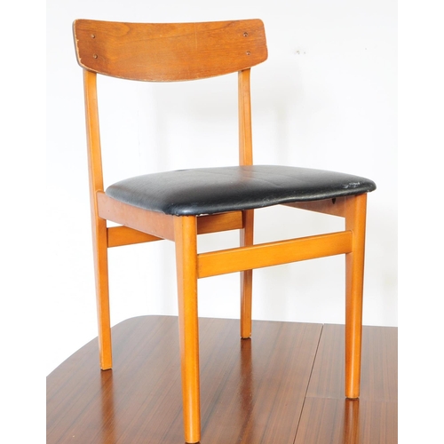 595 - British Modern Design - A retro mid 20th century formica topped dining table and four chairs. The di... 