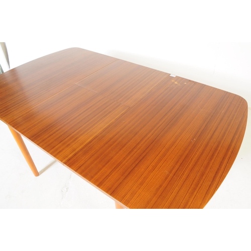 595 - British Modern Design - A retro mid 20th century formica topped dining table and four chairs. The di... 