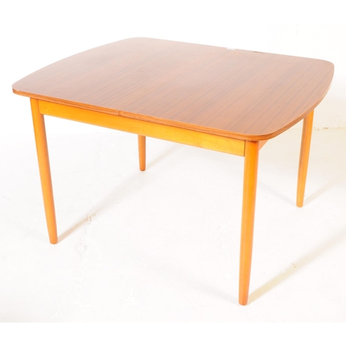 595 - British Modern Design - A retro mid 20th century formica topped dining table and four chairs. The di... 