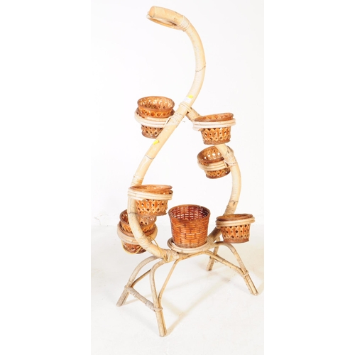 601 - A vintage mid 20th century circa 1960s Italian manner bamboo and wicker plant stand / jardiniere. Th... 