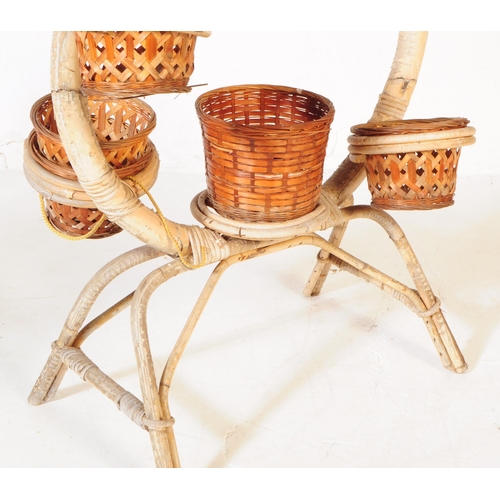 601 - A vintage mid 20th century circa 1960s Italian manner bamboo and wicker plant stand / jardiniere. Th... 