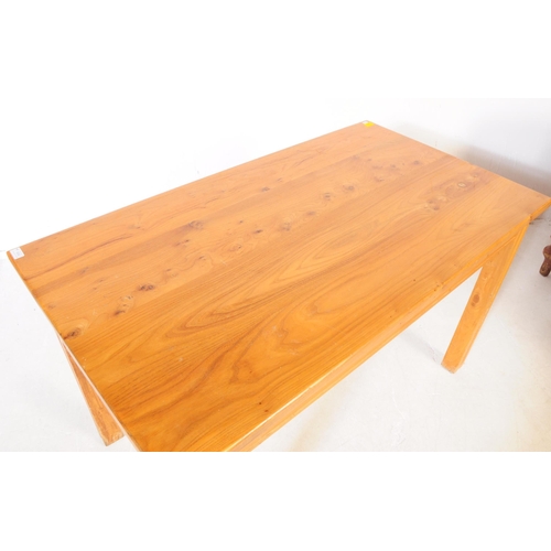 604 - A contemporary pine wood refectory kitchen dining table. The table of rectangular form raised on squ... 