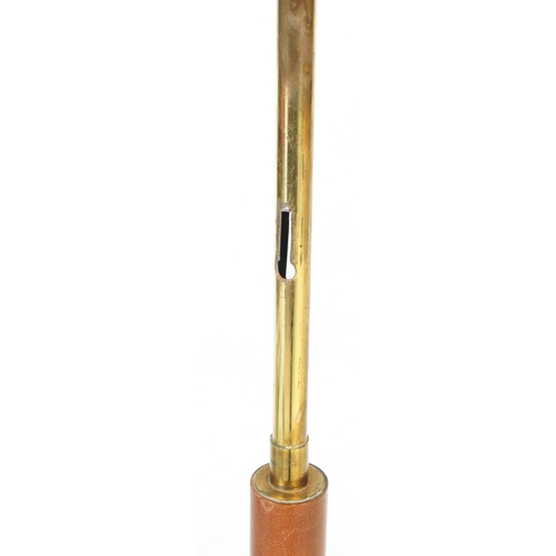 605 - A vintage 20th century floor standing standard lamp light. Having metal and wood construction with a... 