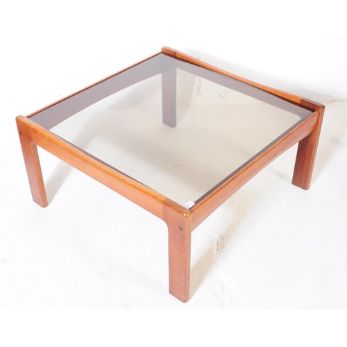 623 - British Modern Design - A pair of mid 20th century teak wood and smoked glass square coffee tables, ... 