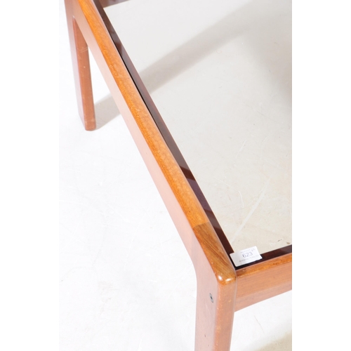 623 - British Modern Design - A pair of mid 20th century teak wood and smoked glass square coffee tables, ... 