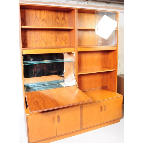 625 - G-Plan - A mid 20th century teak wood G-Plan highboard modular wall unit. Having cupboards to the ba... 