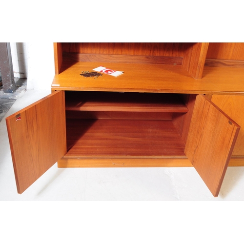 625 - G-Plan - A mid 20th century teak wood G-Plan highboard modular wall unit. Having cupboards to the ba... 