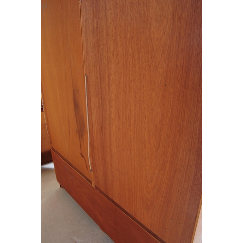 625 - G-Plan - A mid 20th century teak wood G-Plan highboard modular wall unit. Having cupboards to the ba... 