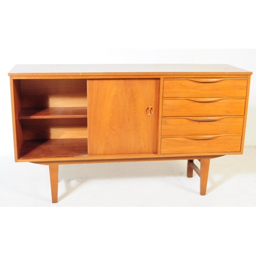 634 - British Modern Design - A mid 20th century teak wood sideboard in the manner of Beautility. Raised o... 