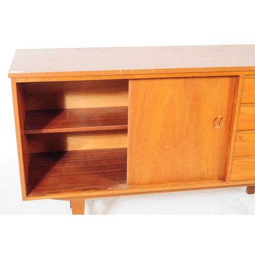 634 - British Modern Design - A mid 20th century teak wood sideboard in the manner of Beautility. Raised o... 