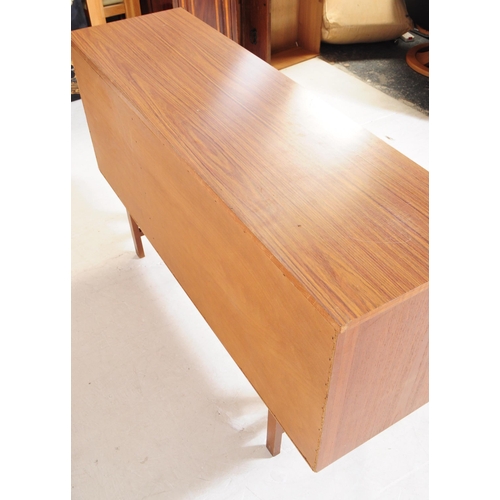 634 - British Modern Design - A mid 20th century teak wood sideboard in the manner of Beautility. Raised o... 