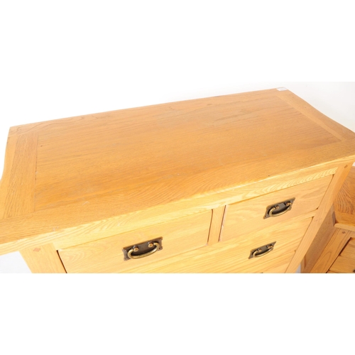 637 - A contemporary Oak Furniture Land manner part bedroom suite. The collection consisting of a chest of... 