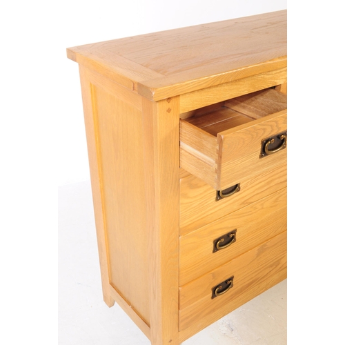 637 - A contemporary Oak Furniture Land manner part bedroom suite. The collection consisting of a chest of... 