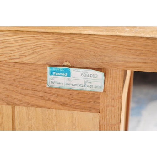 637 - A contemporary Oak Furniture Land manner part bedroom suite. The collection consisting of a chest of... 