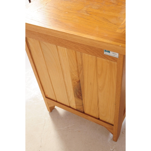 637 - A contemporary Oak Furniture Land manner part bedroom suite. The collection consisting of a chest of... 