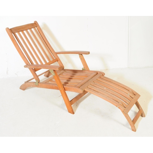 651 - A pair of 20th century teak wood garden furniture folding reclining deck armchairs. The chairs each ... 