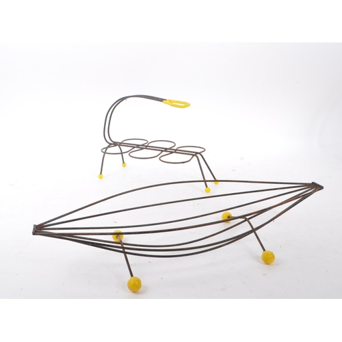 663 - A collection of mid 20th century sputnik atomic style magazine racks and other wire racks. The colle... 