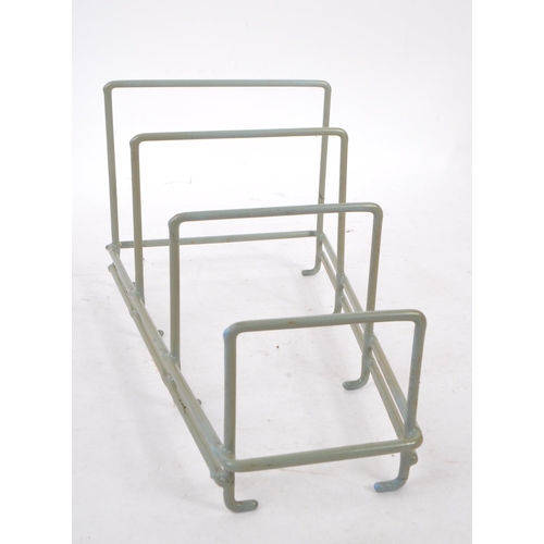 663 - A collection of mid 20th century sputnik atomic style magazine racks and other wire racks. The colle... 