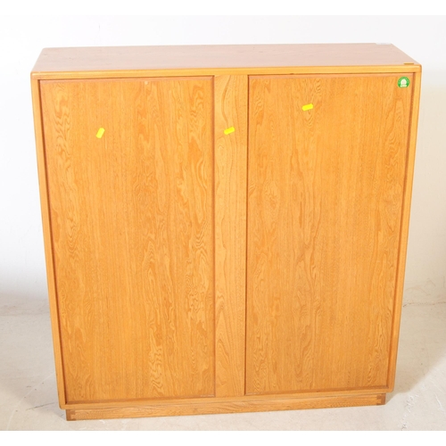 678 - Ercol - Model 810 - A 20th century Ercol Model 810 golden dawn blonde elm display cabinet bookcase. ... 