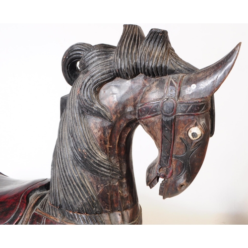 680 - A large oversized mid 20th century possibly German carousel style solid wood carved horse. In a stan... 