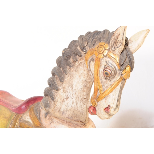 683 - A mid 20th century European merry go round carousel hand carved wooden horse. In a white ground with... 