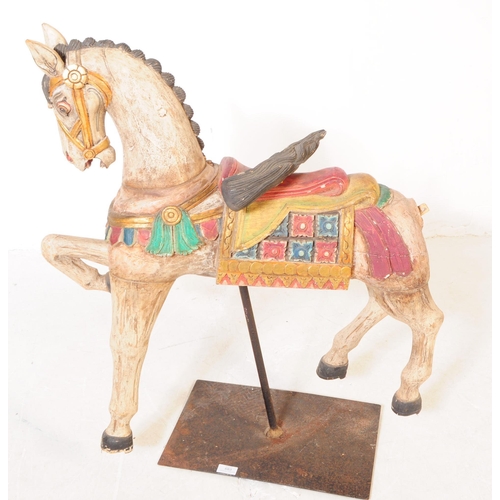 683 - A mid 20th century European merry go round carousel hand carved wooden horse. In a white ground with... 