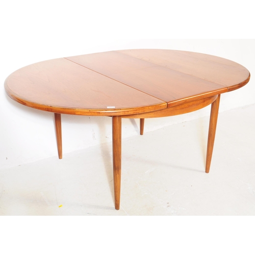 691 - G-Plan - Fresco Range - A mid 20th century G-Plan Fresco range teak wood dining table alongside four... 