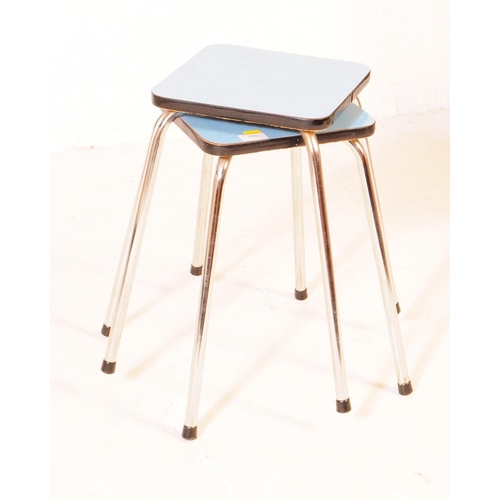 693 - British Modern Design - A pair of mid 20th century formica and chrome stools / side tables. Each sto... 