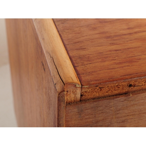 696 - British Modern Design - A mid 20th century teak wood sideboard credenza. The sideboard having a bank... 