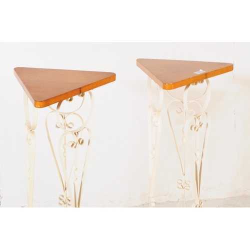 700 - A pair of mid 20th century wood and metal jardinière plant stands. The stands having triangular wood... 