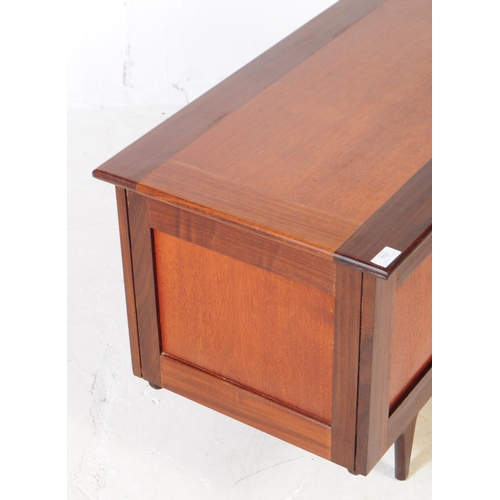 702 - British Modern Design - A mid 20th century teak and afromosia wood blanket box coffer. The blanket b... 