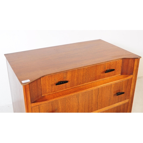 714 - Austinsuite - A mid 20th century Austinsuite teak veneered chest of drawers. The chest having a bank... 