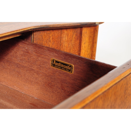 714 - Austinsuite - A mid 20th century Austinsuite teak veneered chest of drawers. The chest having a bank... 