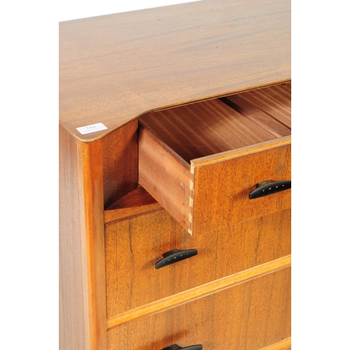 714 - Austinsuite - A mid 20th century Austinsuite teak veneered chest of drawers. The chest having a bank... 