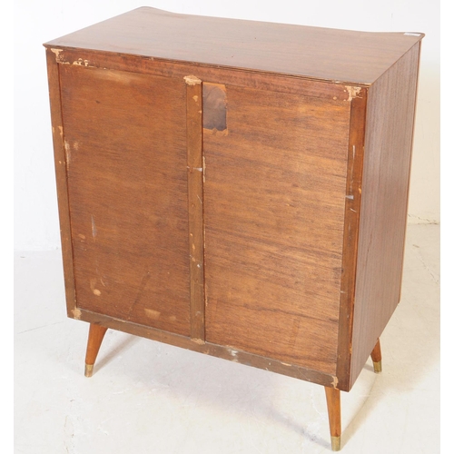 714 - Austinsuite - A mid 20th century Austinsuite teak veneered chest of drawers. The chest having a bank... 