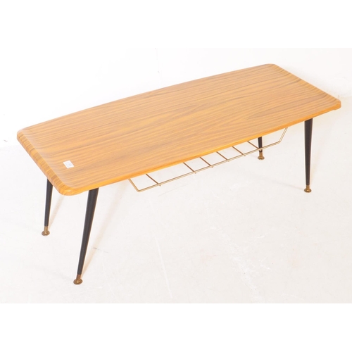 717 - British Modern Design - A mid 20th century formica topped long john coffee table. The table having a... 