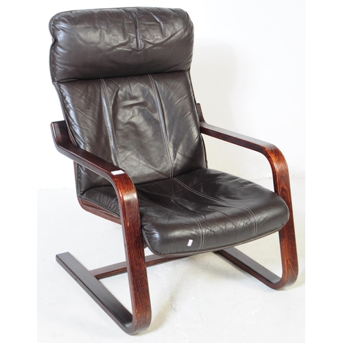 718 - A 20th century bentwood frame armchair / lounge chair. The chair raised on a bentwood frame, with cu... 