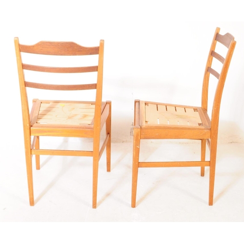 723 - Gordon Russell of Broadway - A set of four retro mid 2th century dining chairs. Having a horizontal ... 