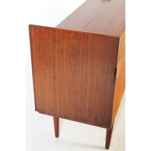 732 - Danish Modern Design - A mid 20th century walnut veneered sideboard credenza. The sideboard raised o... 