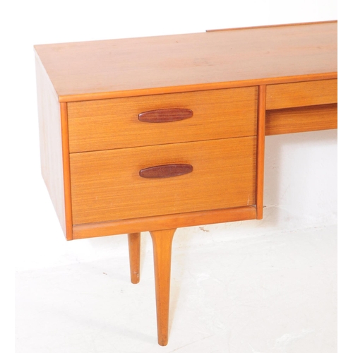 733 - Austinsuite Furniture - A mid 20th century Austinsuite teak veneered dressing table desk. The dresse... 