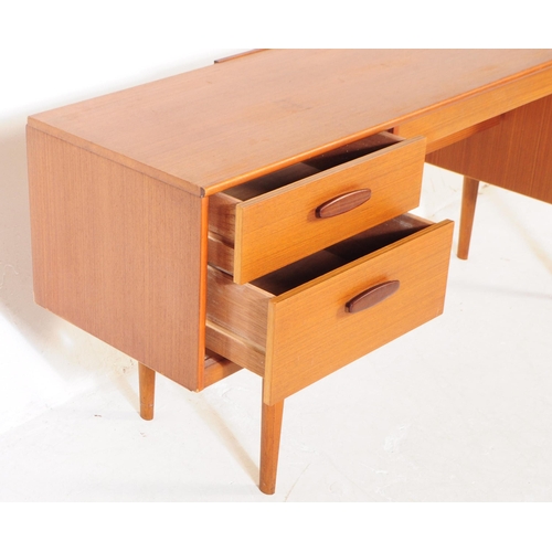 733 - Austinsuite Furniture - A mid 20th century Austinsuite teak veneered dressing table desk. The dresse... 